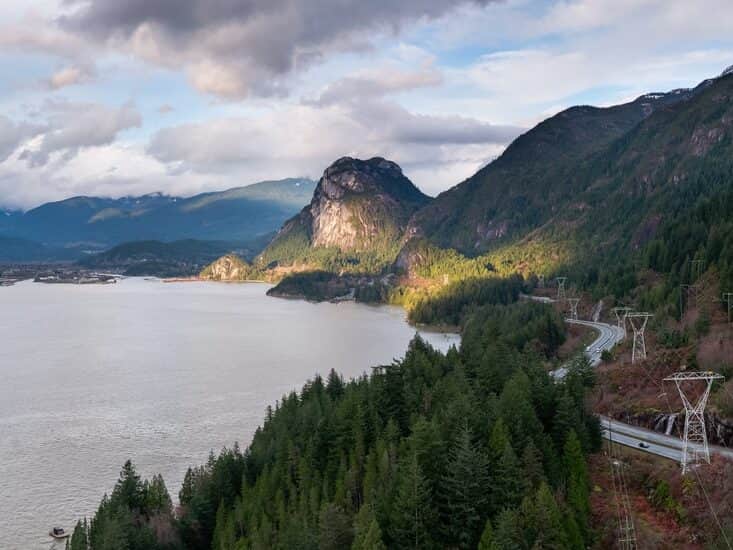 Mountains beside a serene waterway.