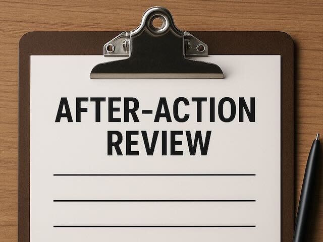 a clipboard with After-Action Review title